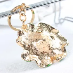 Kikker op groen lotusblad - kristal versierde sleutelhangerSleutelhangers