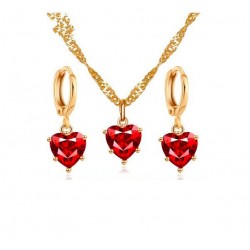 Gyllene halsband och örhängen med rött hjärta