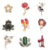 Papegaaien - libel - kikker - bloem - ballerina - kristallen brocheBroches