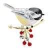 A bird sitting on a branch - crystal broochBrooches