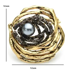 Vogelnest met parel - broche van kristalBroches