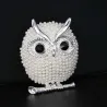 Kristallen broche met pareluilBroches