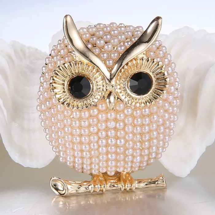 Kristallen broche met pareluilBroches