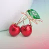 Elegante broche met een rode kristallen kersBroches