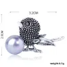 Vintage vogel broche met parelBroches