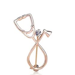 Stethoscope shaped brooch with crystalBrooches
