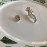 Silver brooch with a hand holding rose - pinBrooches