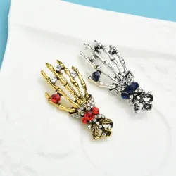 Crystal skull hand - vintage broochBrooches