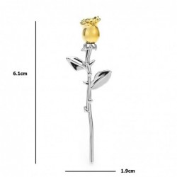 Elegant silver brooch with a golden roseBrooches