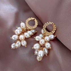 Elegante gouden oorbellen - met meerdere lagen parelsOorbellen