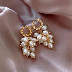 Elegante gouden oorbellen - met meerdere lagen parelsOorbellen