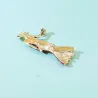 Fashionable brooch - a woman in a blue dress with a crystal handbagBrooches
