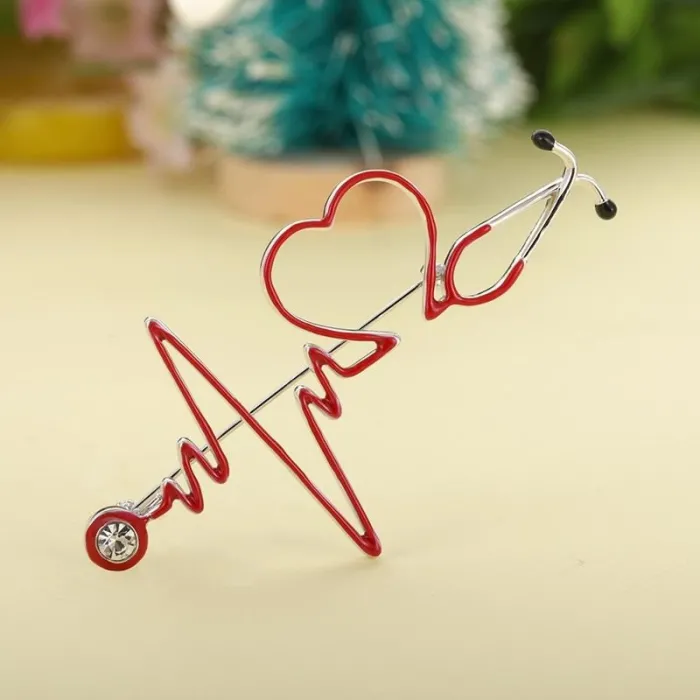 Medische broche - elektrocardiogram / stethoscoop / hart - met kristalBroches