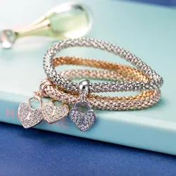 Elegante driedelige armband - met kristallen hartjes - zilver - goud - roségoudArmbanden