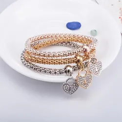Elegante driedelige armband - met kristallen hartjes - zilver - goud - roségoudArmbanden