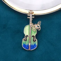 Stijlvolle broche met gitaar & kristallen vlinderBroches