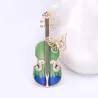 Stijlvolle broche met gitaar & kristallen vlinderBroches
