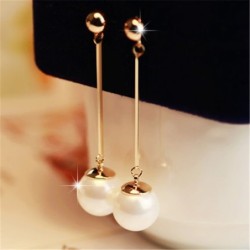Long golden earrings with a pearlEarrings