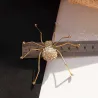 Gouden kristallen spin - brocheBroches
