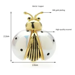 Wit/gouden lieveheersbeestje brocheBroches