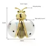 Wit/gouden lieveheersbeestje brocheBroches