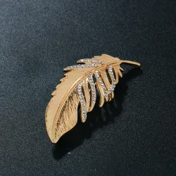 Golden feather brooch - with crystalsBrooches