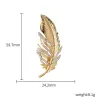 Golden feather brooch - with crystalsBrooches