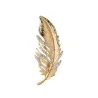 Golden feather brooch - with crystalsBrooches
