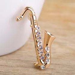 Gouden kristallen saxofoon - brocheBroches