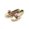 Retro broche - gouden schoenen / strass bloemenBroches