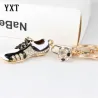 Kristallen voetbalschoen / bal - sleutelhangerSleutelhangers