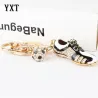 Kristallen voetbalschoen / bal - sleutelhangerSleutelhangers