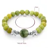 Groene natuursteen kralen / zilveren olifant - armbandArmbanden