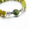 Groene natuursteen kralen / zilveren olifant - armbandArmbanden
