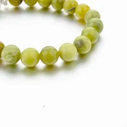 Groene natuursteen kralen / zilveren olifant - armbandArmbanden