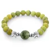 Groene natuursteen kralen / zilveren olifant - armbandArmbanden
