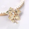 Flower with crystal / pearl - golden broochBrooches