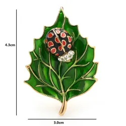 Brooch with beetle and leafBrooches