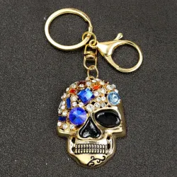 Gouden sleutelhanger met kristallen schedelSleutelhangers