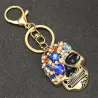 Gouden sleutelhanger met kristallen schedelSleutelhangers