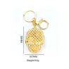 Gouden sleutelhanger met kristallen schedelSleutelhangers