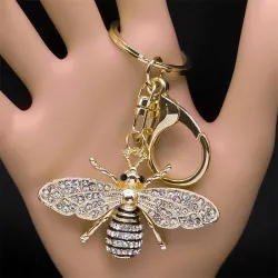 Gouden sleutelhanger met een kristallen bijSleutelhangers