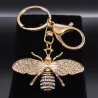 Gouden sleutelhanger met een kristallen bijSleutelhangers