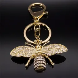 Gouden sleutelhanger met een kristallen bijSleutelhangers