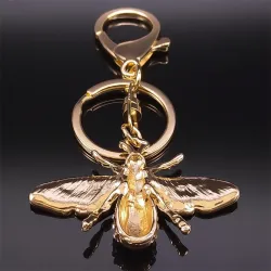 Gouden sleutelhanger met een kristallen bijSleutelhangers