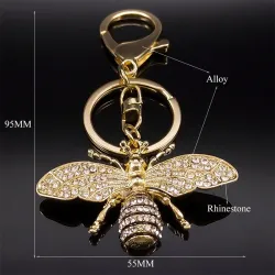 Gouden sleutelhanger met een kristallen bijSleutelhangers