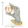 Crystal hand with a pearl - elegant broochBrooches