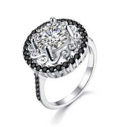 Elegante zilveren ring - uitgeholde bloem - wit/zwarte kristallenRingen