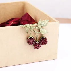 Fruitbroche met granaatappelmotiefBroches